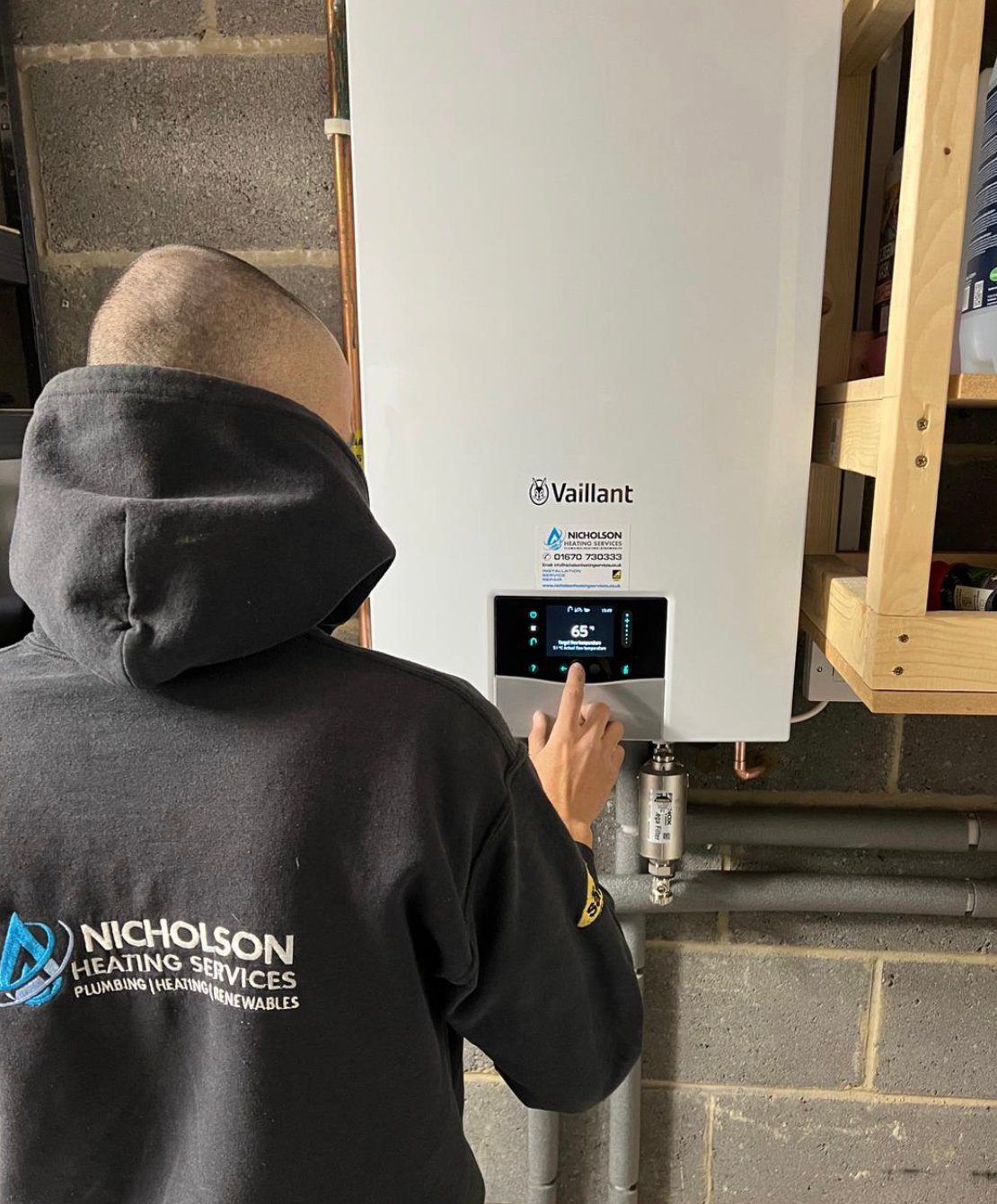 A heating engineer providing installation of a new vaillant boiler